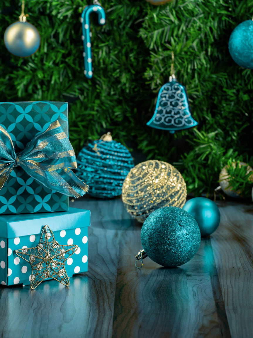 Dad pushing Daughter in Cardboard Box on Hardwood Floors
